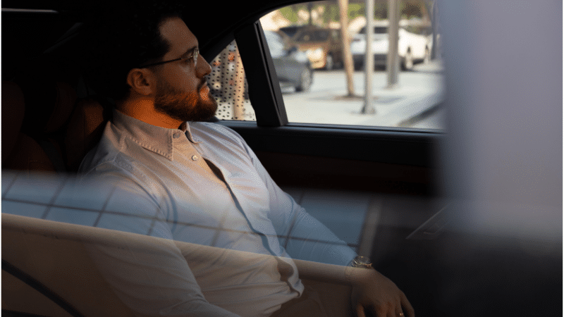 man in the car looking in the window